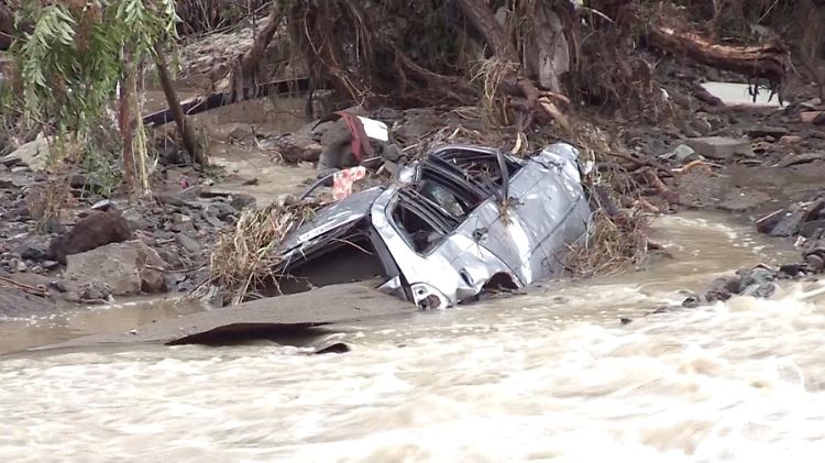 A drone view shows flooded cars in Elenite