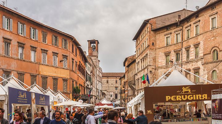 Perugia, Italy - October 23, 2013: Tourists visiting the Eurochocolate, the annual chocolate festival that has been held in Perugia since 1993. This is one of the largest chocolate festivals in Europe and always attracts many people from all over the world.