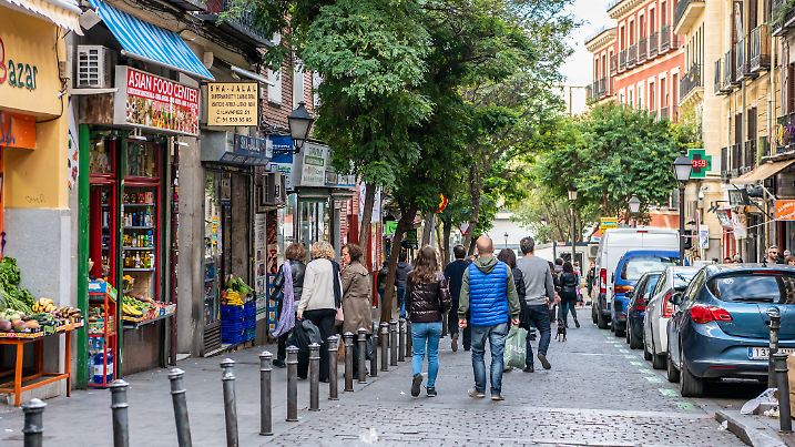 Madrid / Spain - October 19, 2019: People wander the popular Lavapies neighborhood in central Madrid, known for its great nightlife.