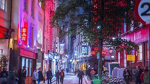 London, UK - 8 November, 2024: Spirit of Christmas, Soho West ends Christmas lights, London illuminated for 2025. Crowd on streets, people enjoying festive atmosphere