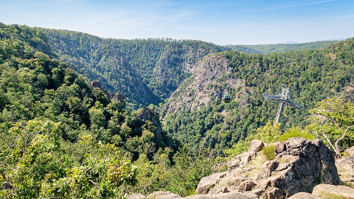 
Witch Dance Square, Germany – August 27, 2024:  A cable car is heading for Witch Dance Square from its base station in the city of Thale. It’s a popular tourist spot in the Harz Mountains.