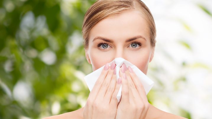 cosmetics, health and beauty concept - beautiful woman with paper tissue