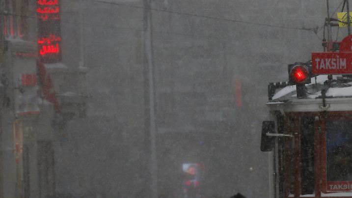 A vintage tram runs along the main shopping and pedestrian street of Istiklal during a snowfall in central Istanbul, Turkey January 7, 2017. REUTERS/Murad Sezer