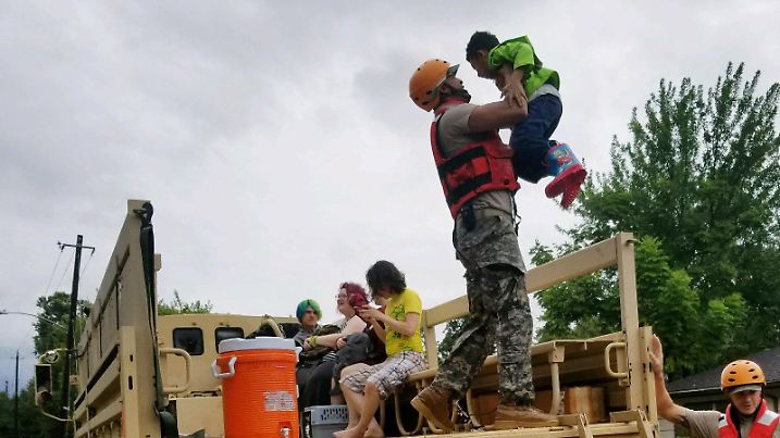 Texas National Guard soldiers aid residents in heavily flooded areas from the storms of Hurricane Harvey in Houston, Texas, U.S., August 27, 2017       Lt. Zachary West, 100th MPAD/Texas Military Department/Handout via REUTERS   ATTENTION EDITORS - THIS IMAGE WAS PROVIDED BY A THIRD PARTY