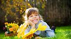 autumn kid with maple leaves