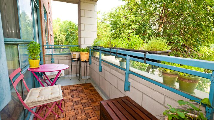 Balcony of condo with patio furniture and plants